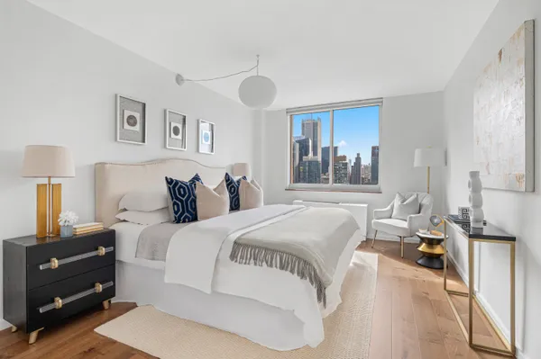 a bedroom with a bed and a cabinets