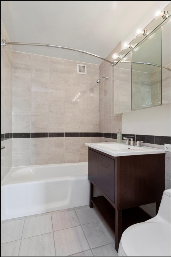 35 West 33rd Street, Unit 12A Manhattan, NY 10001 - Photo 6 of 28 a bathroom with a sink and mirror