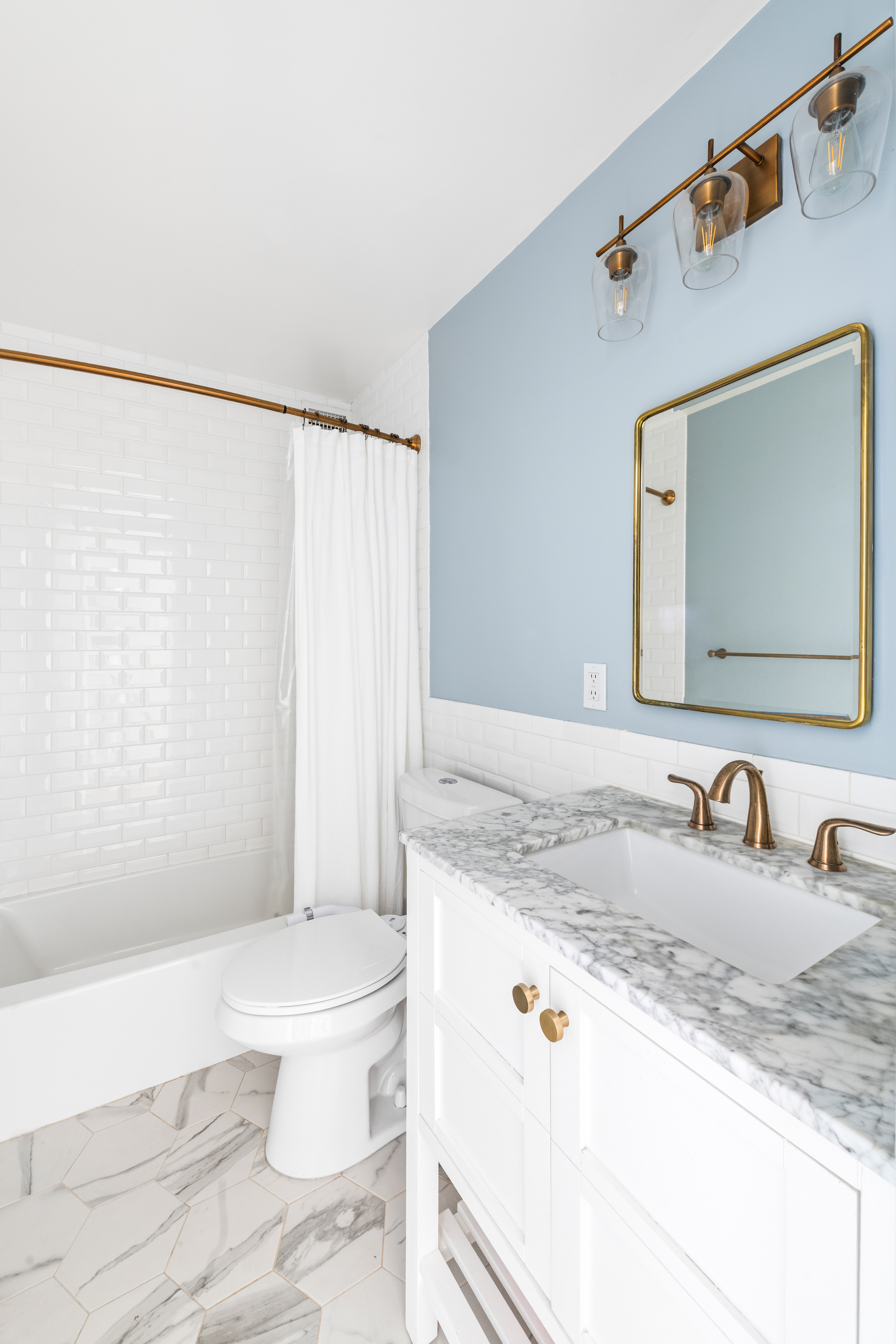 444 East 86th Street, Unit 16B Manhattan, NY 10028 - Photo 9 of 14 a bathroom with a granite countertop sink and a mirror