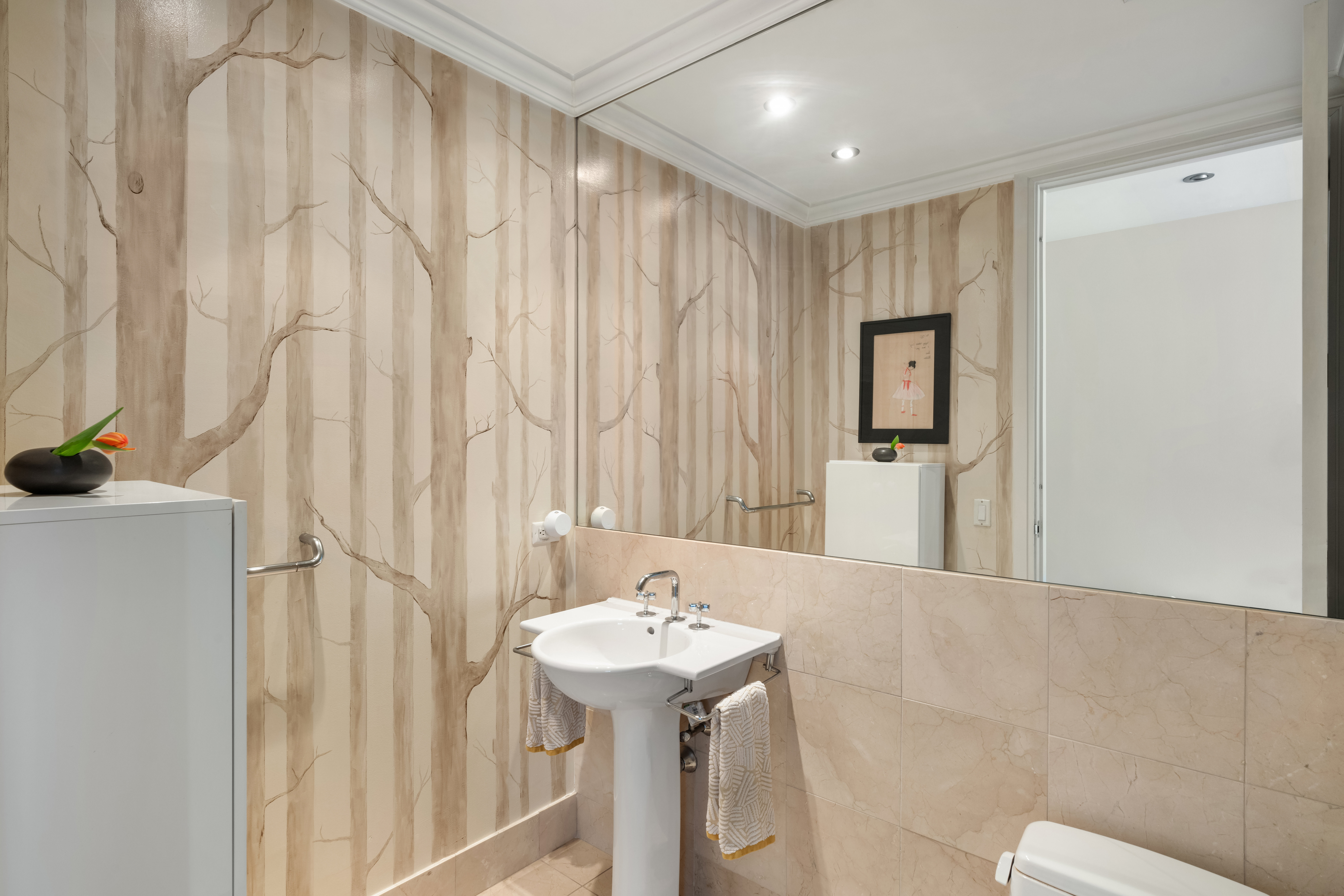 545 West 110th Street, Unit 9D Manhattan, NY 10025 - Photo 11 of 17 a bathroom with a sink a mirror and a shower