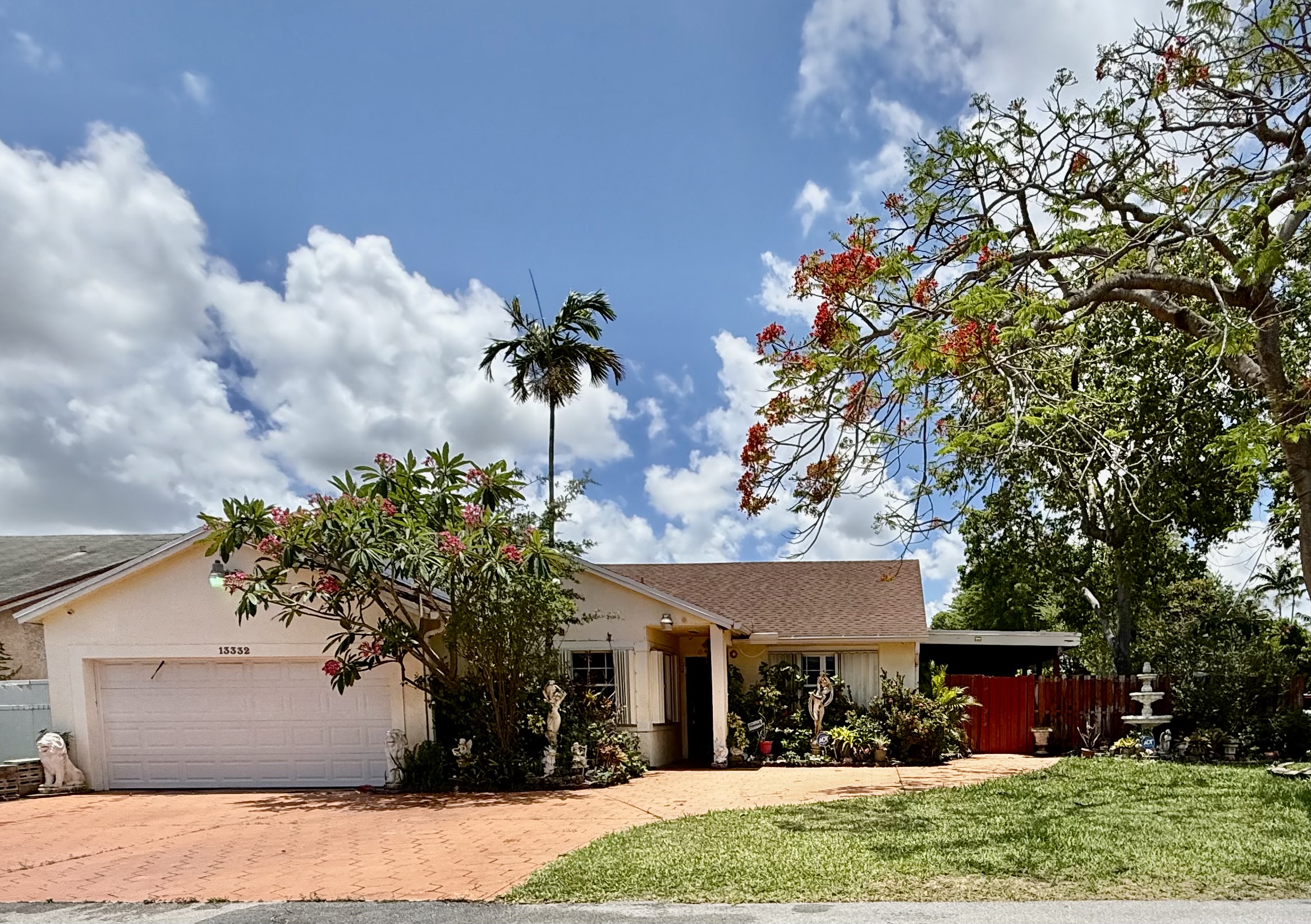 13332 Southwest 113th Court Miami, FL 33176 - Photo 1 of 1 a front view of a house with a garden