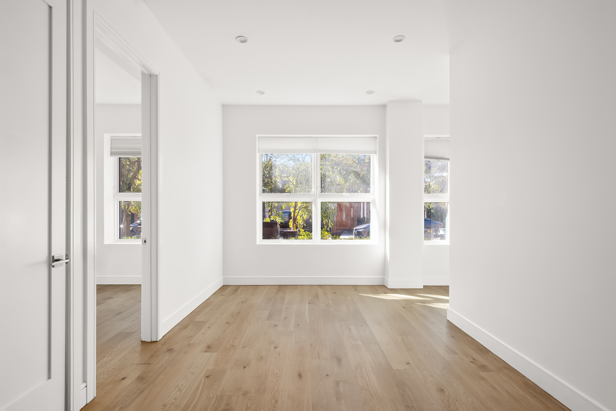 45 Garnet Street, Unit 1A Brooklyn, NY 11231 - Photo 5 of 13 an empty room with wooden floor and windows