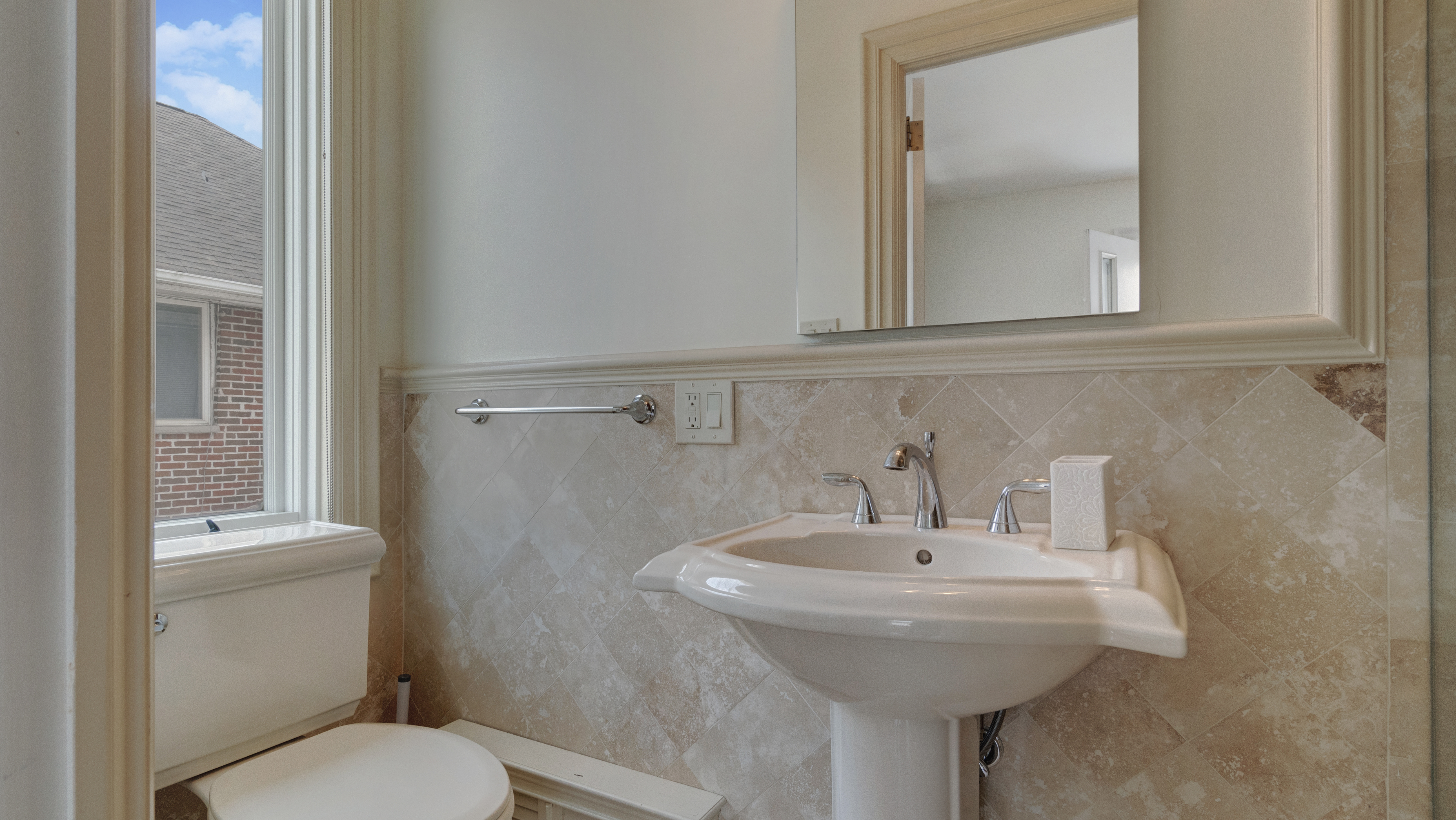 278 Amherst Street Brooklyn, NY 11235 - Photo 22 of 24 a bathroom with a sink toilet and mirror