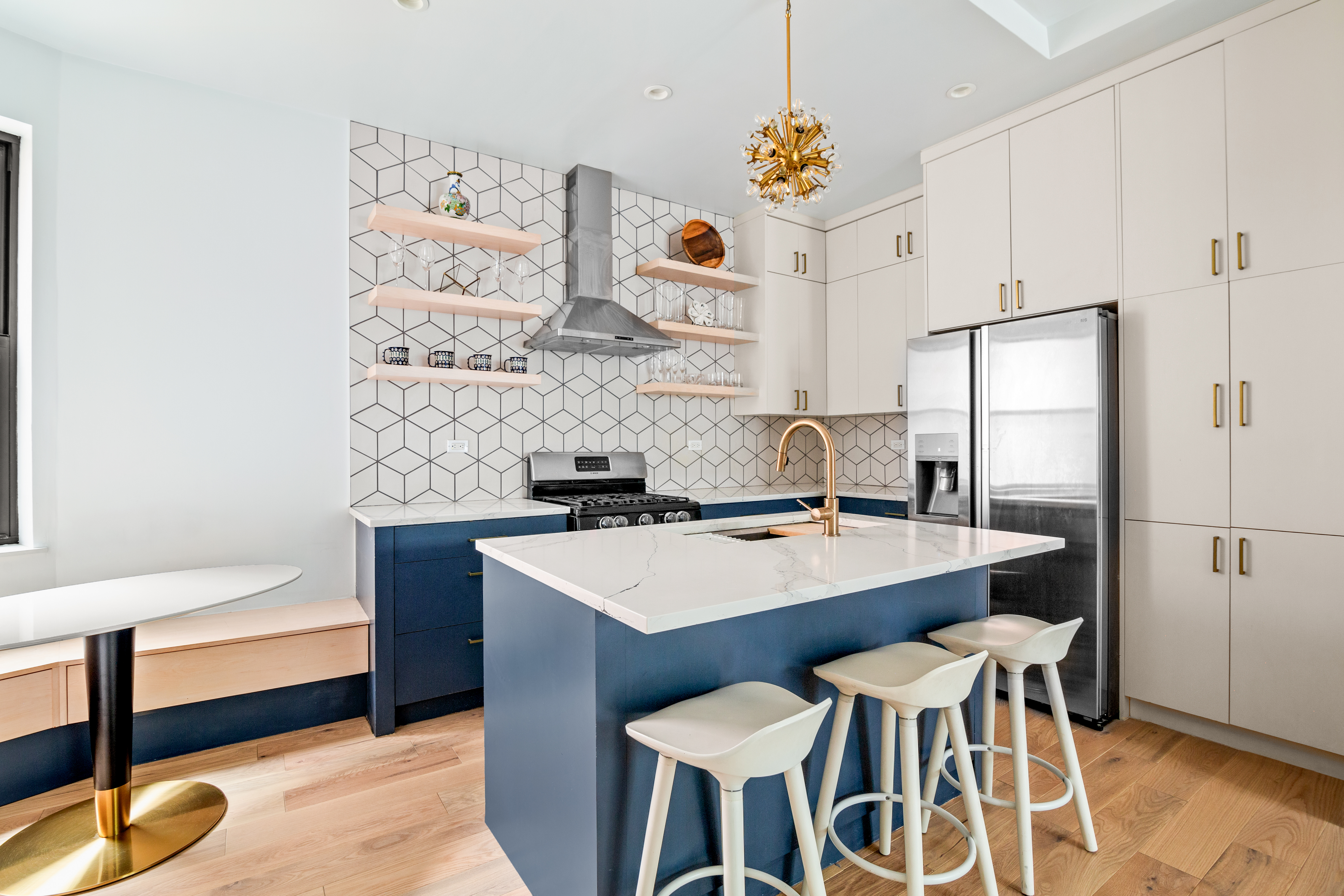 170 East 94th Street, Unit 1C Manhattan, NY 10128 - Photo 2 of 9 a kitchen that has a table and chairs in it