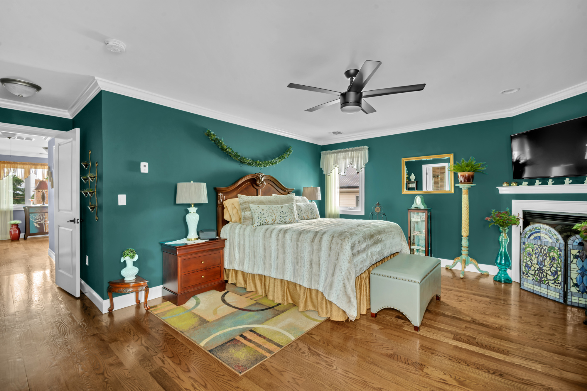909 Jewett Avenue Staten Island, NY 10314 - Photo 24 of 65 a bedroom with a bed and a flat screen tv