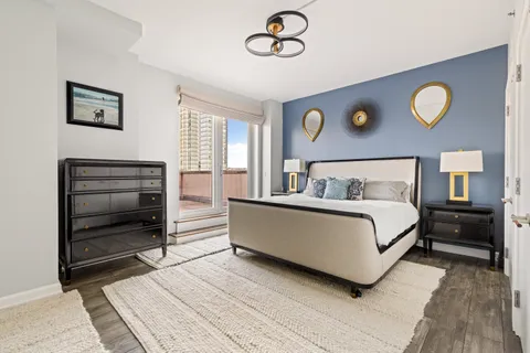 a bedroom with a bed and a table