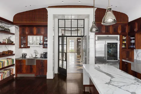 a kitchen with stainless steel appliances granite countertop a stove and cabinets
