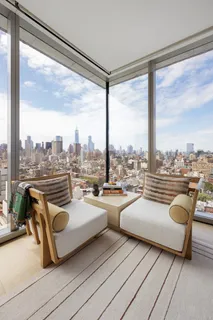 a very nice looking living room with a couch and a large window