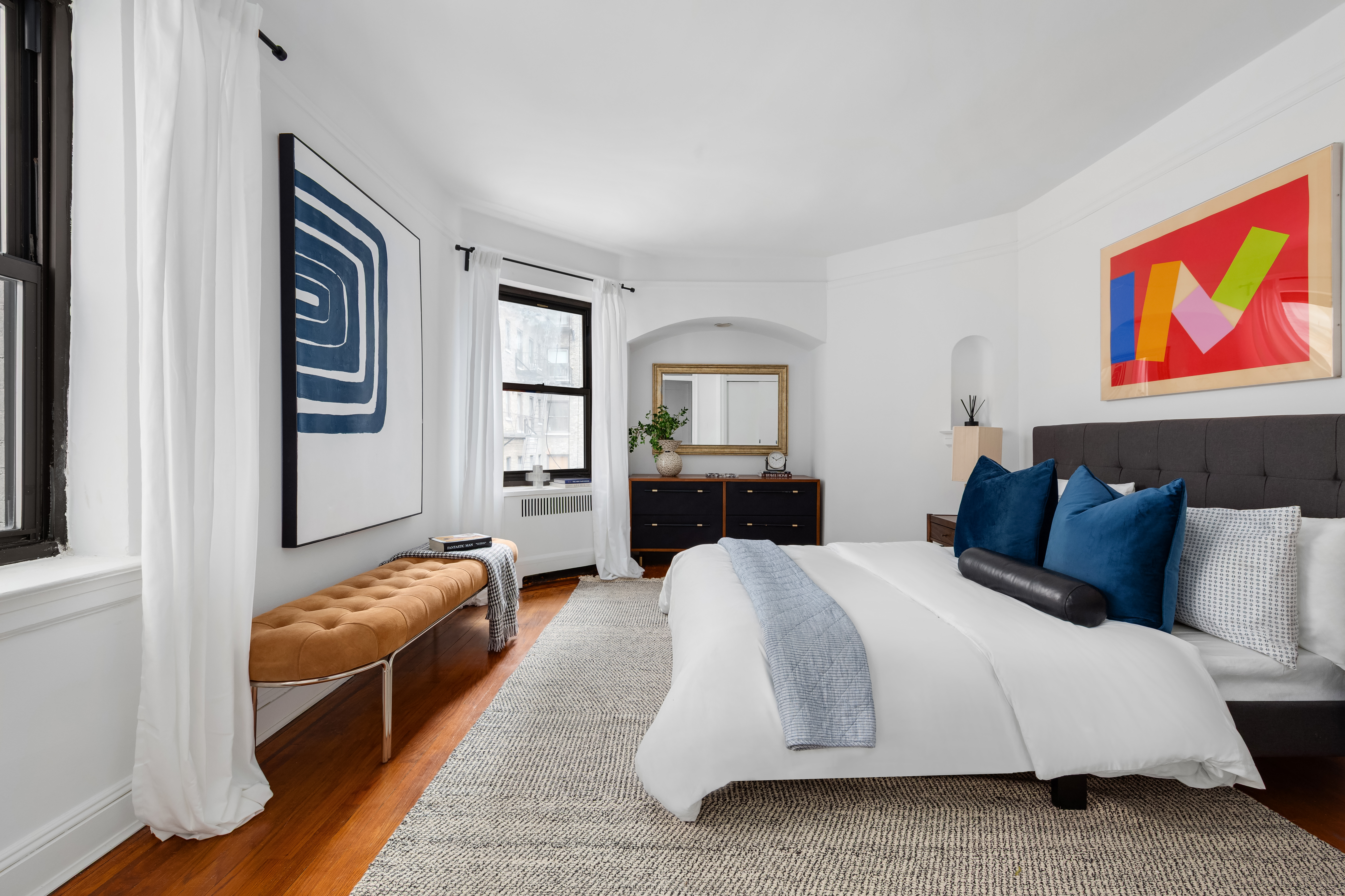 62 East 87th Street, Unit 5AB Manhattan, NY 10128 - Photo 5 of 10 a spacious bedroom with a bed and furniture