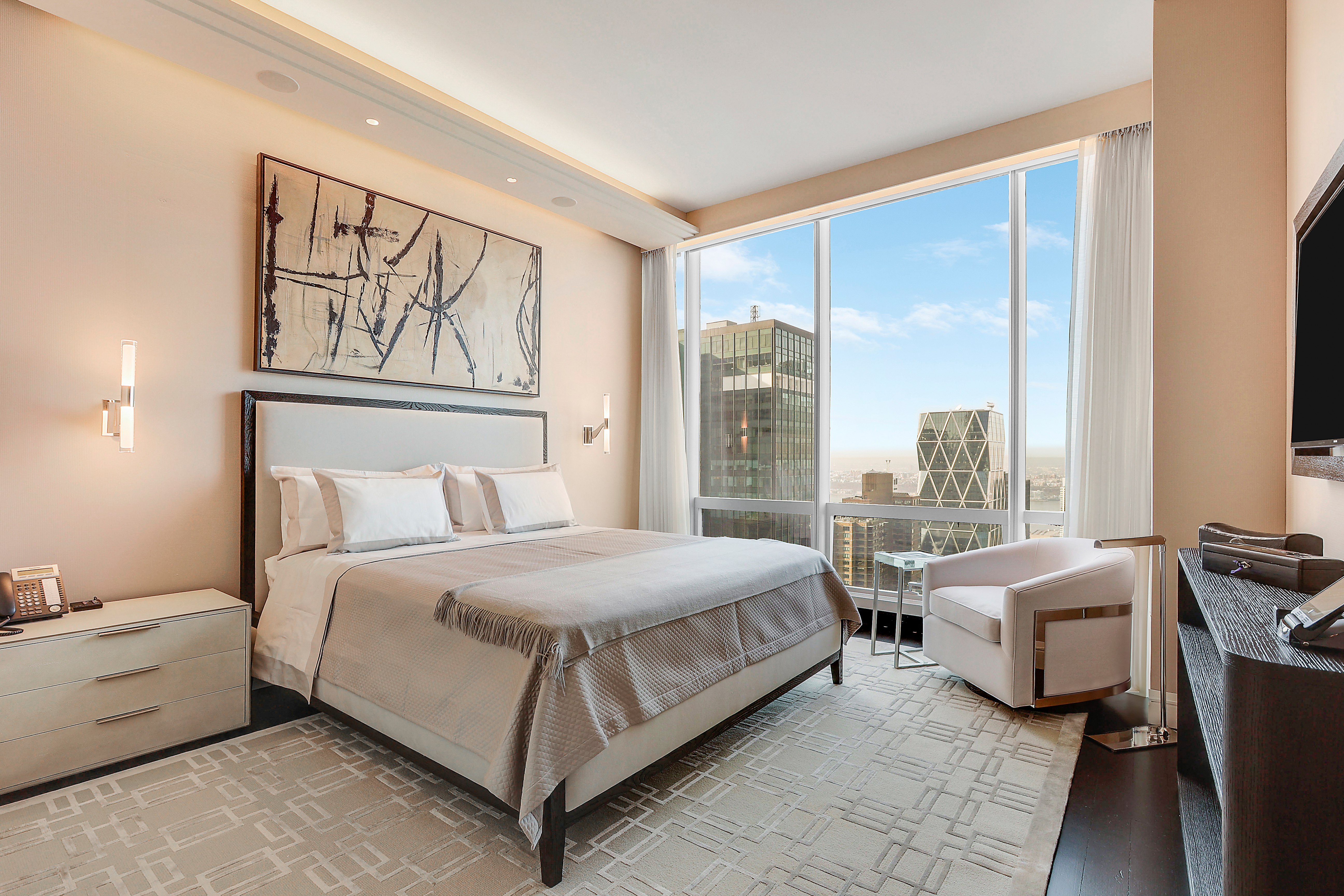 157 West 57th Street, Unit 51A Manhattan, NY 10019 - Photo 6 of 15 a bedroom with a bed and a large window