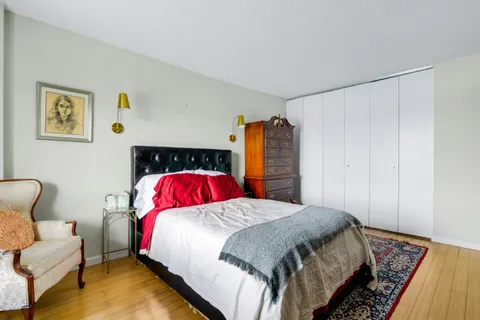 a bedroom with a bed and a couch