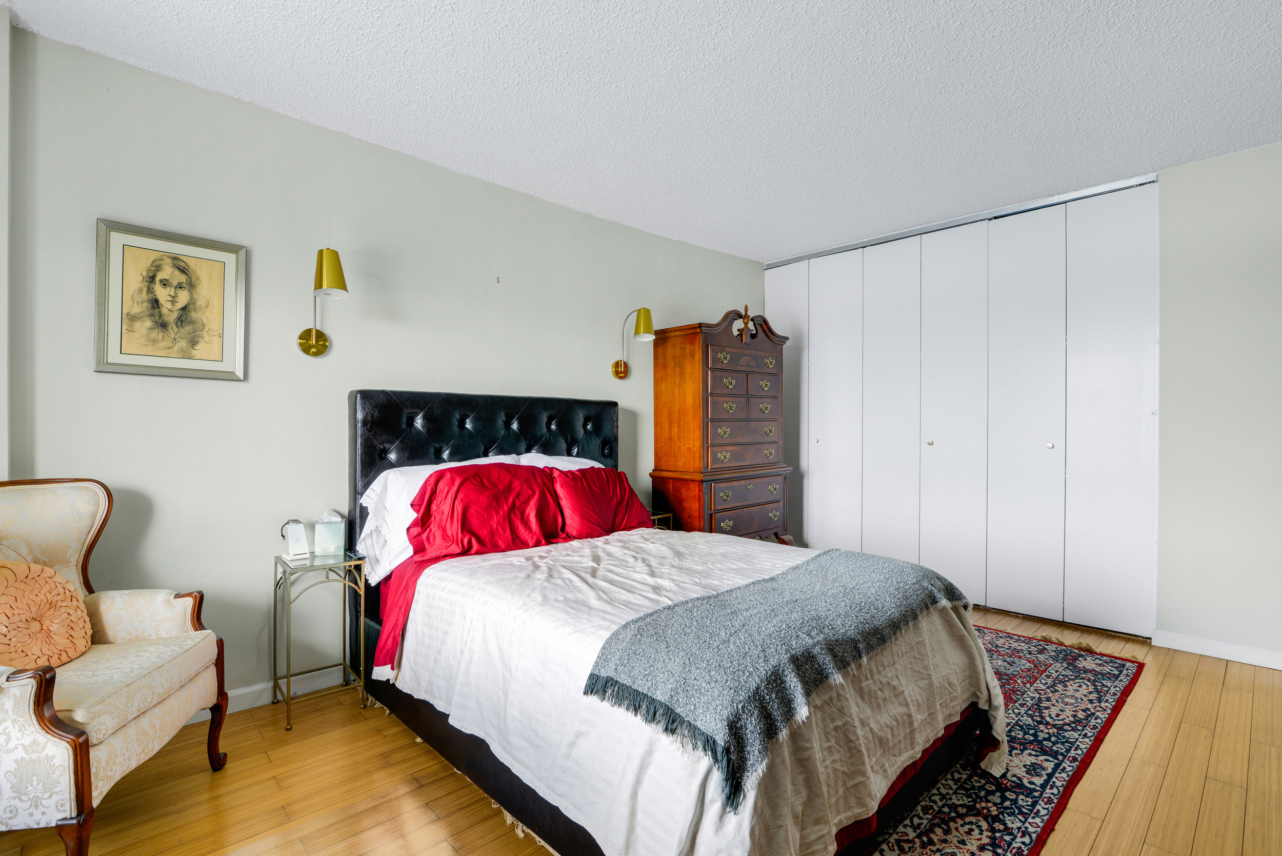 2540 Shore Boulevard, Unit 4S Queens, NY 11102 - Photo 8 of 21 a bedroom with a bed and a couch