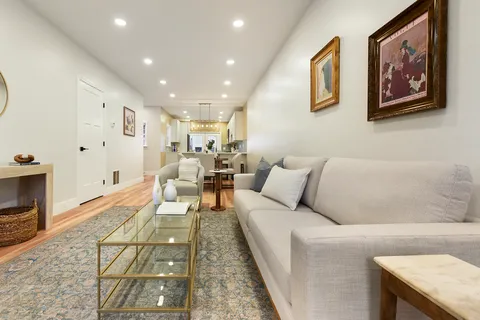 a living room with furniture and a couch