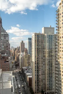 a view of a city with tall buildings