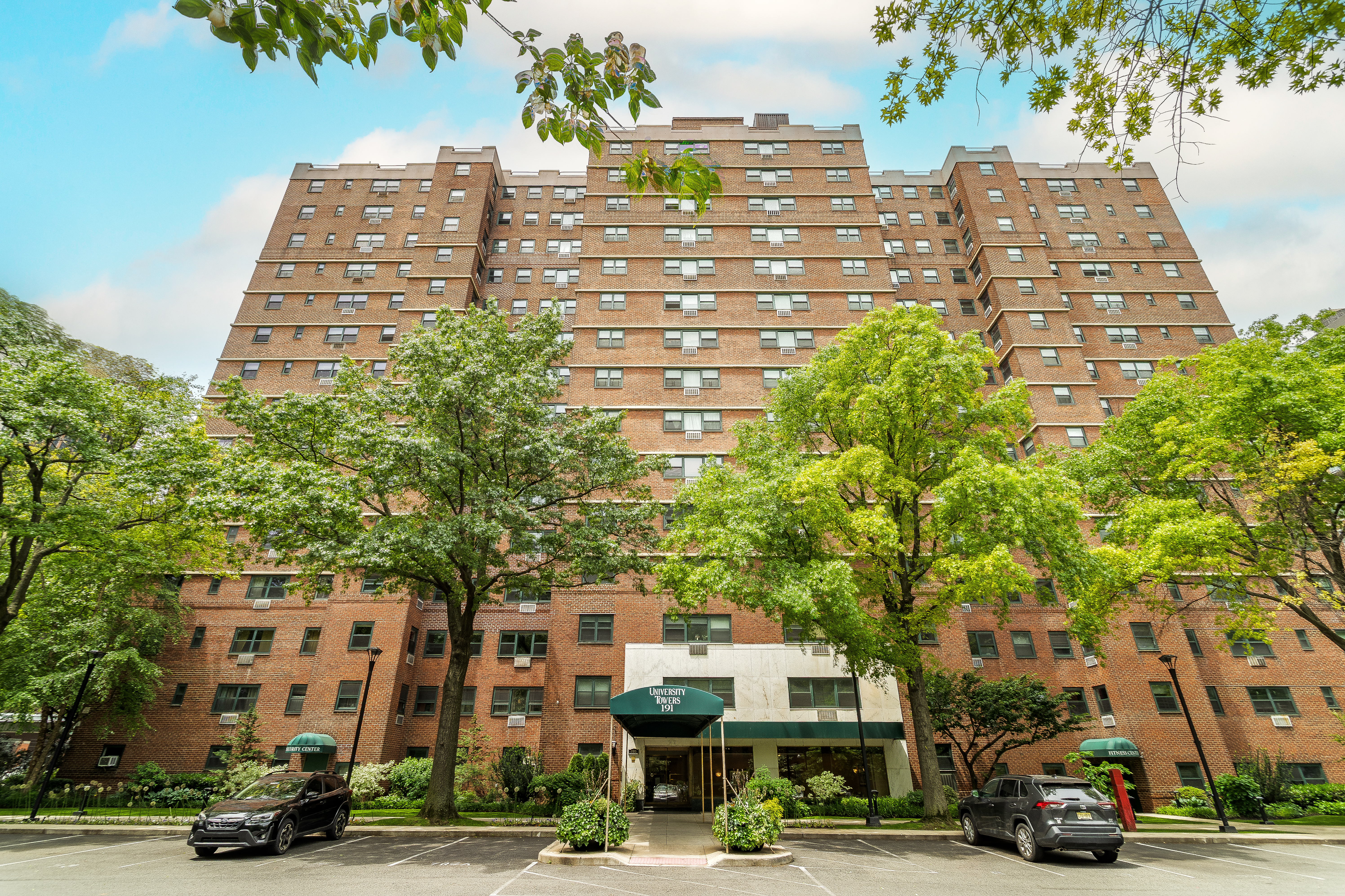 191 Willoughby Street, Unit 12J Brooklyn, NY 11201 - Photo 17 of 19 a view of a building and car parked on the roadside