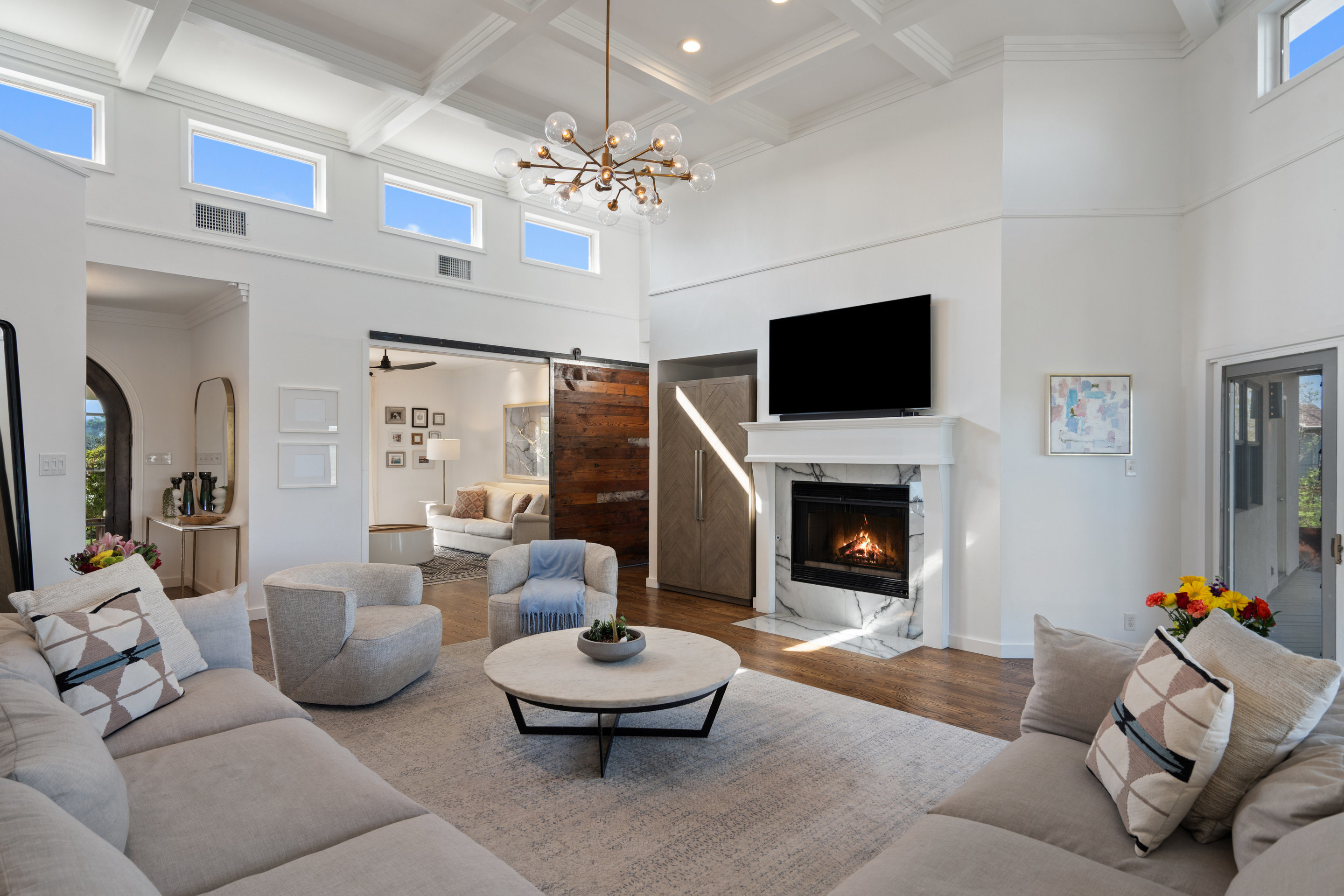 5319 Backtrail Drive Austin, TX 78731 - Photo 10 of 35 a living room with furniture a fireplace and a flat screen tv