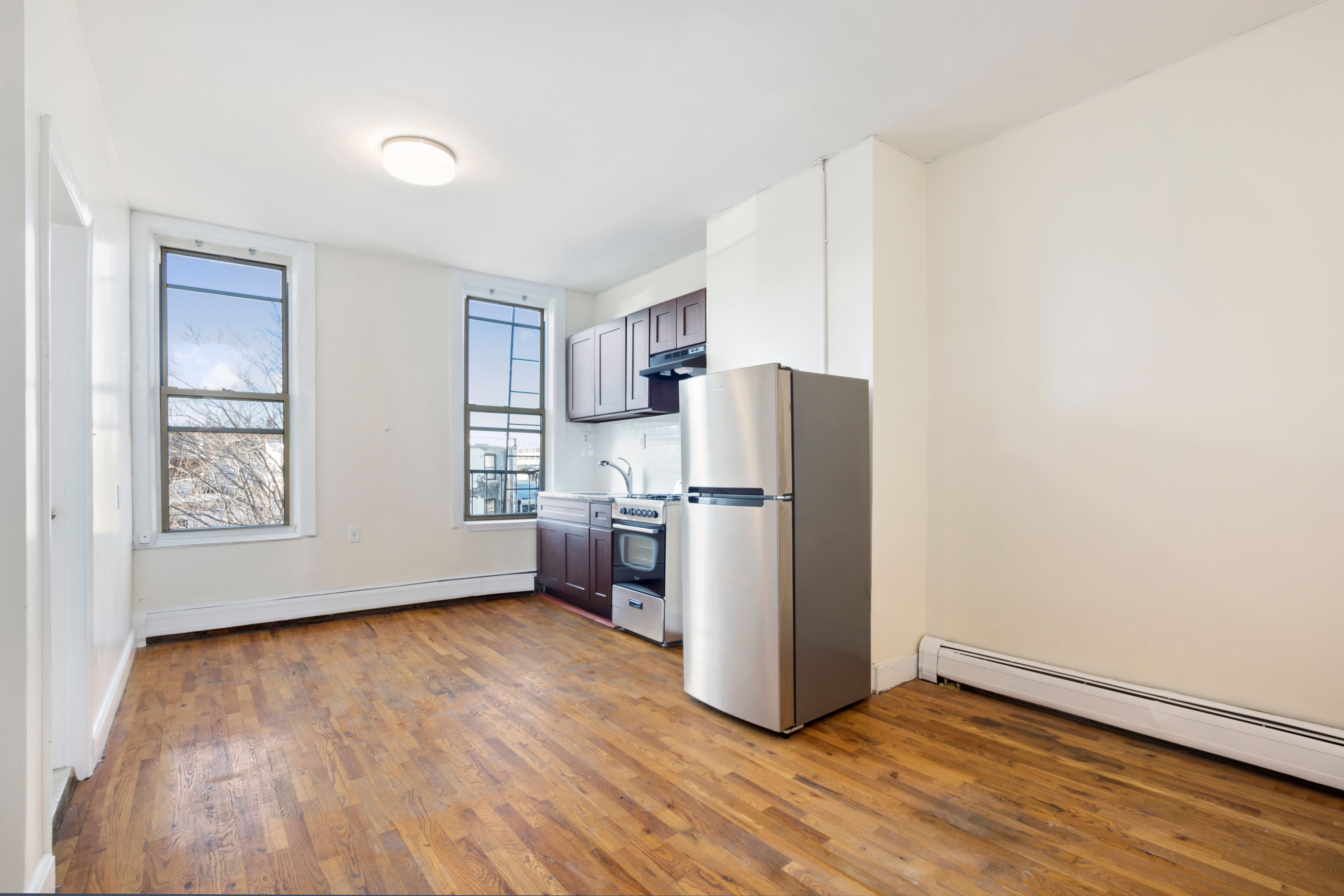 148 29th Street Brooklyn, NY 11232 - Photo 6 of 31 a view of kitchen with stainless steel appliances wooden floor and a window