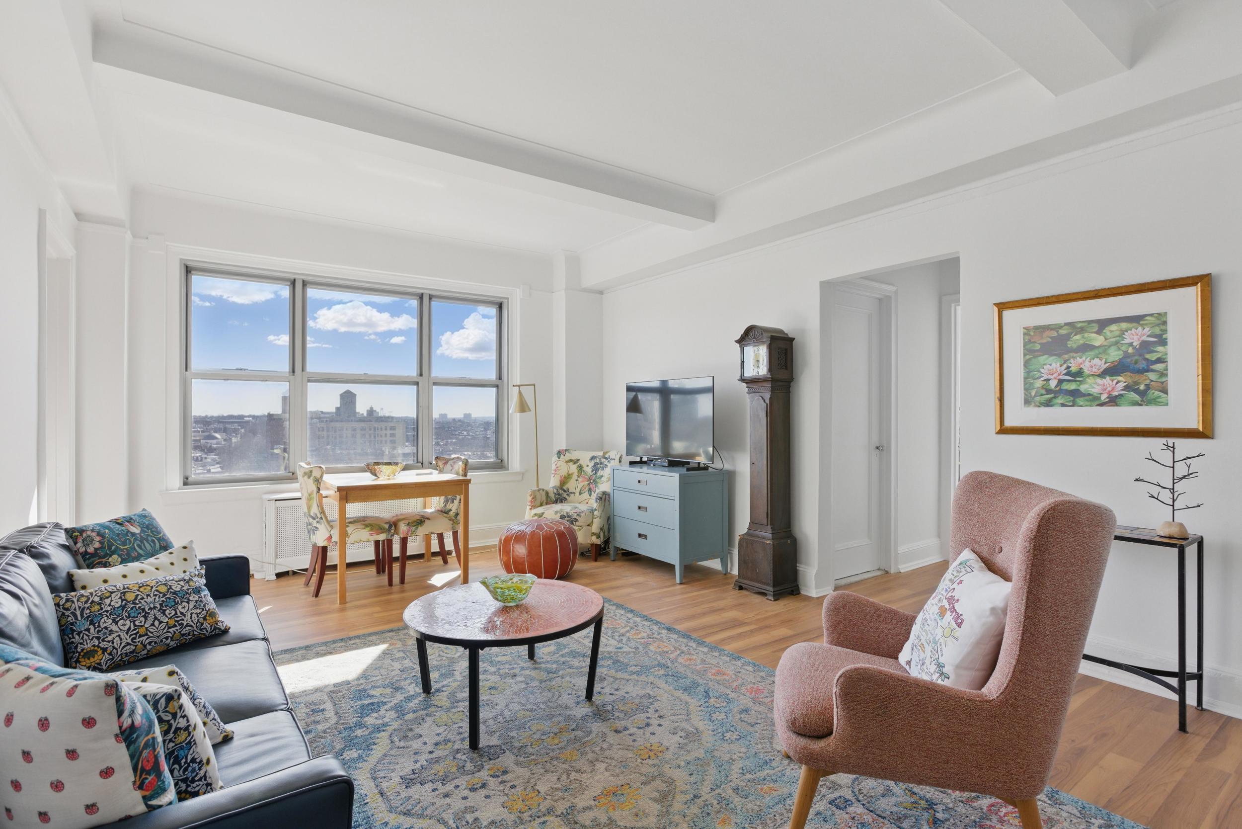 1 Plaza Street West, Unit 12C Brooklyn, NY 11217 - Photo 3 of 13 a living room with furniture and a large window