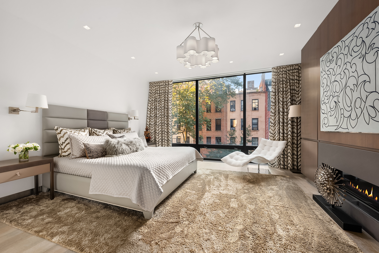 184 East 75th Street Manhattan, NY 10021 - Photo 9 of 20 a bedroom with a bed and a large window