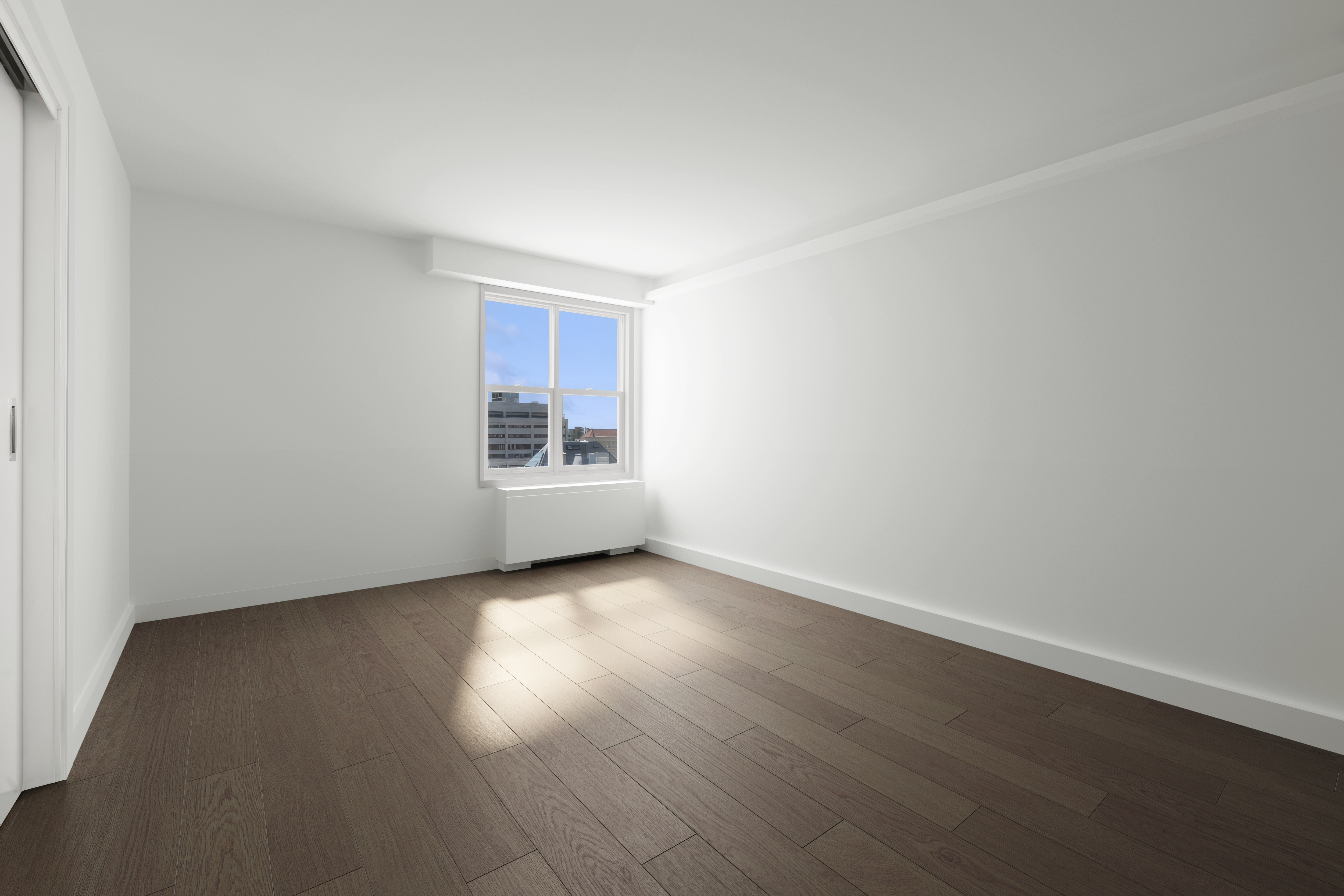 205 3rd Avenue, Unit 21H Manhattan, NY 10003 - Photo 12 of 17 an empty room with wooden floor and windows