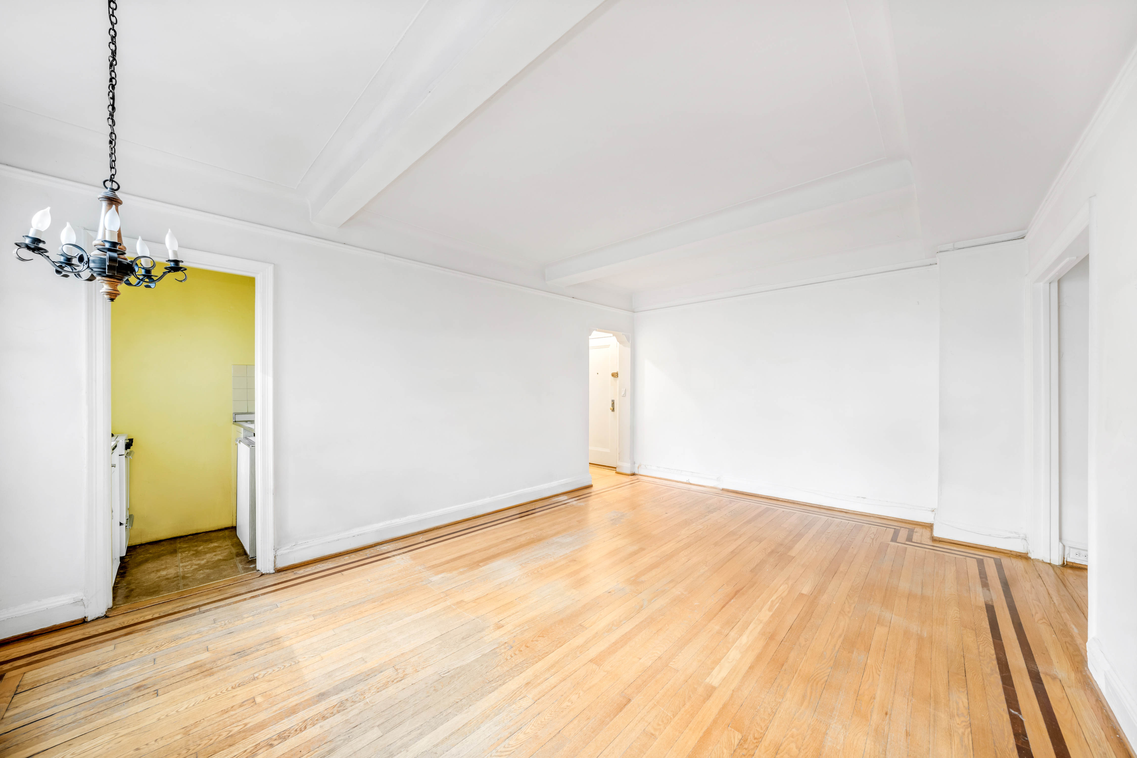 235 East 22nd Street, Unit 2R Manhattan, NY 10010 - Photo 4 of 15 a view of empty room with wooden floor