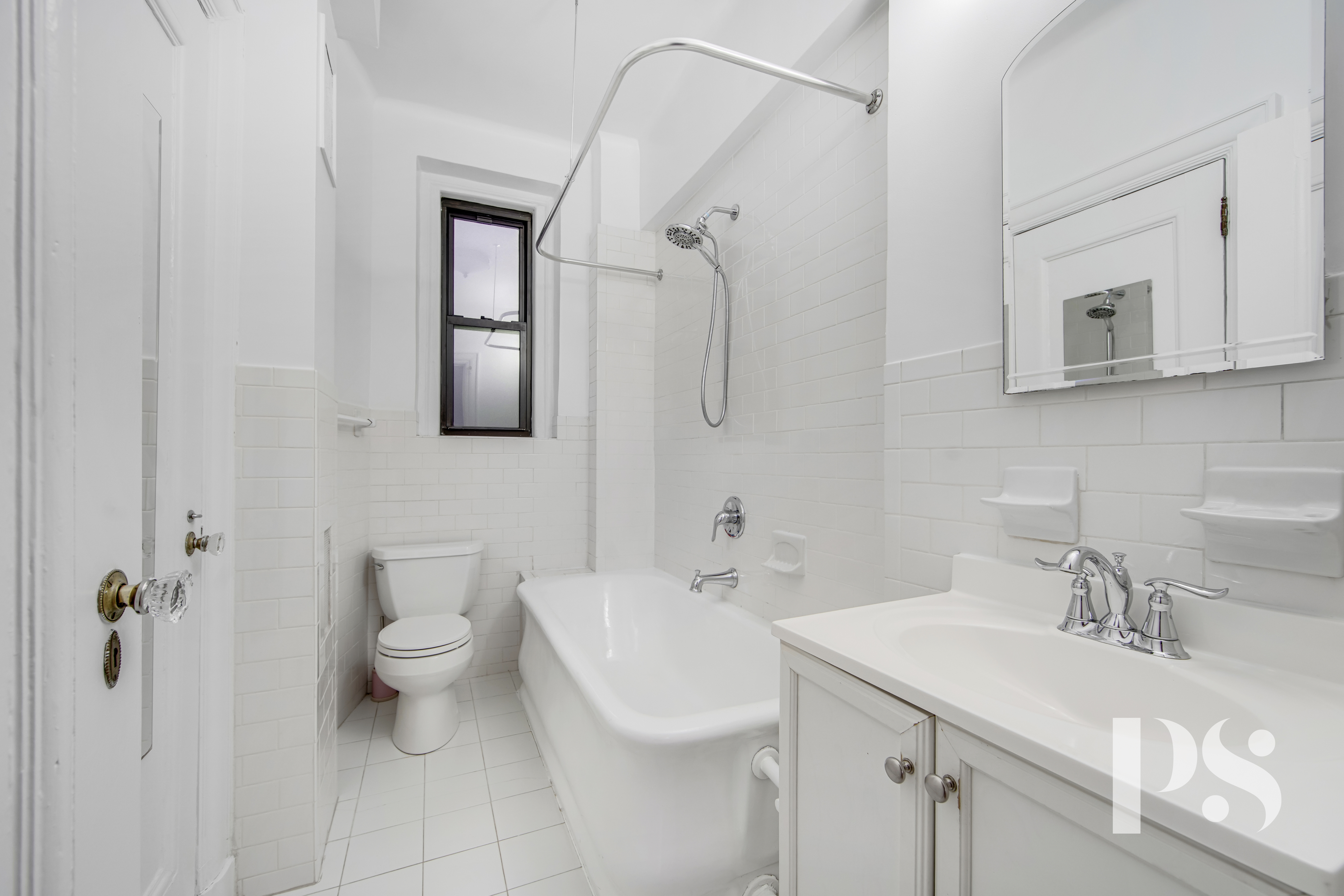 200 West 54th Street, Unit 6J Manhattan, NY 10019 - Photo 7 of 12 a bathroom with a toilet sink and mirror