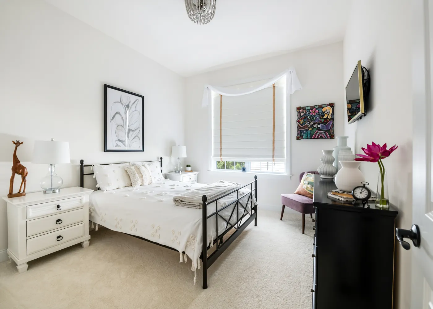 a spacious bedroom with a bed and a window