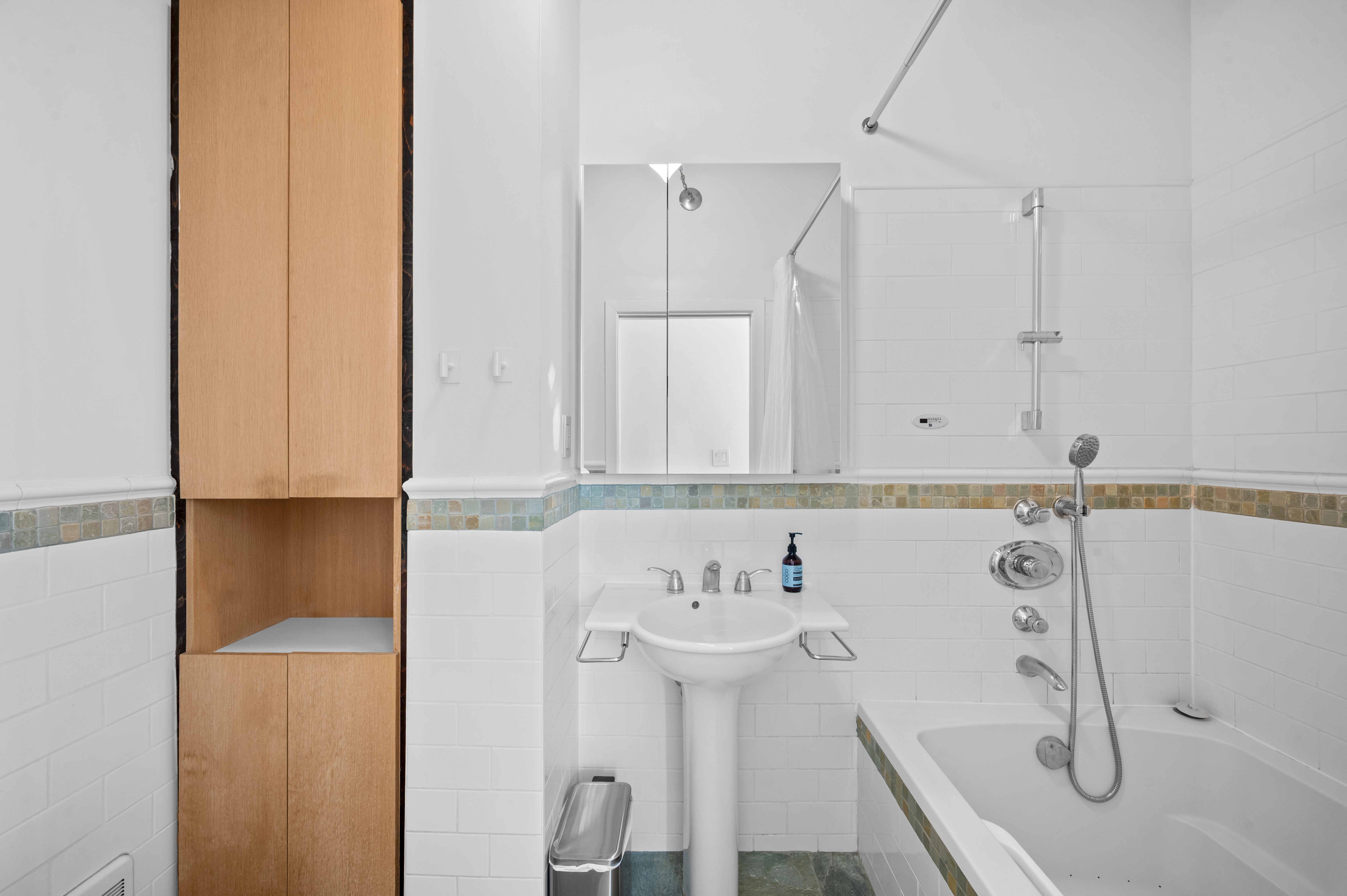 206 West 85th Street, Unit 5 Manhattan, NY 10024 - Photo 7 of 15 a bathroom with a sink and a mirror