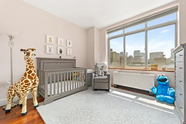a bedroom with furniture and a window