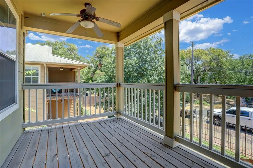 a view of a porch with wooden floor