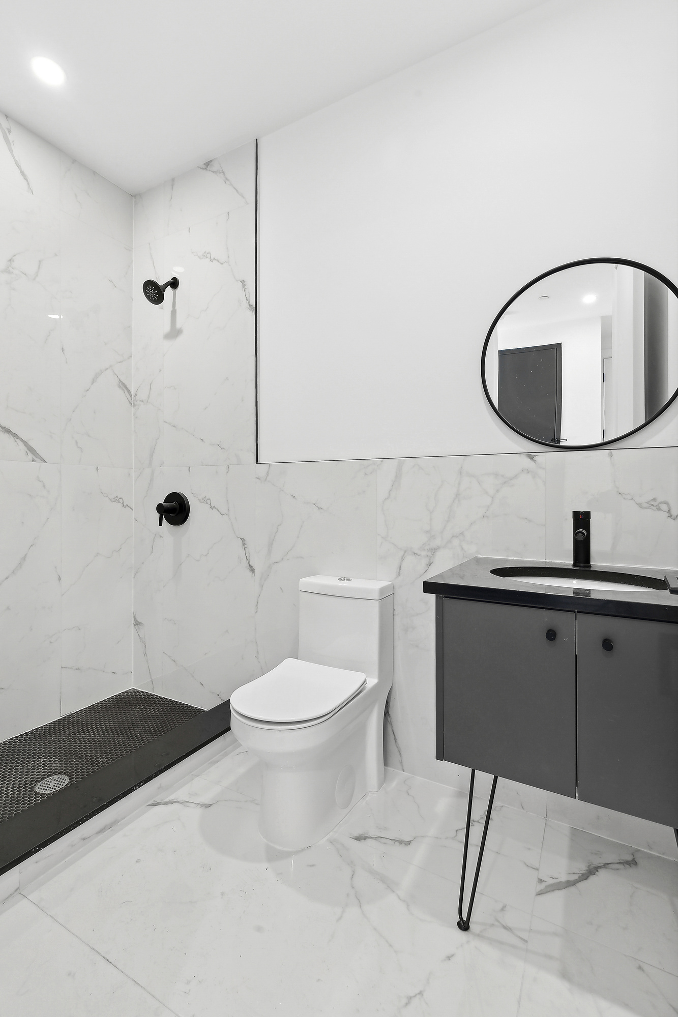 893 Knickerbocker Avenue, Unit 2 Brooklyn, NY 11207 - Photo 9 of 11 a bathroom with a sink a toilet and mirror