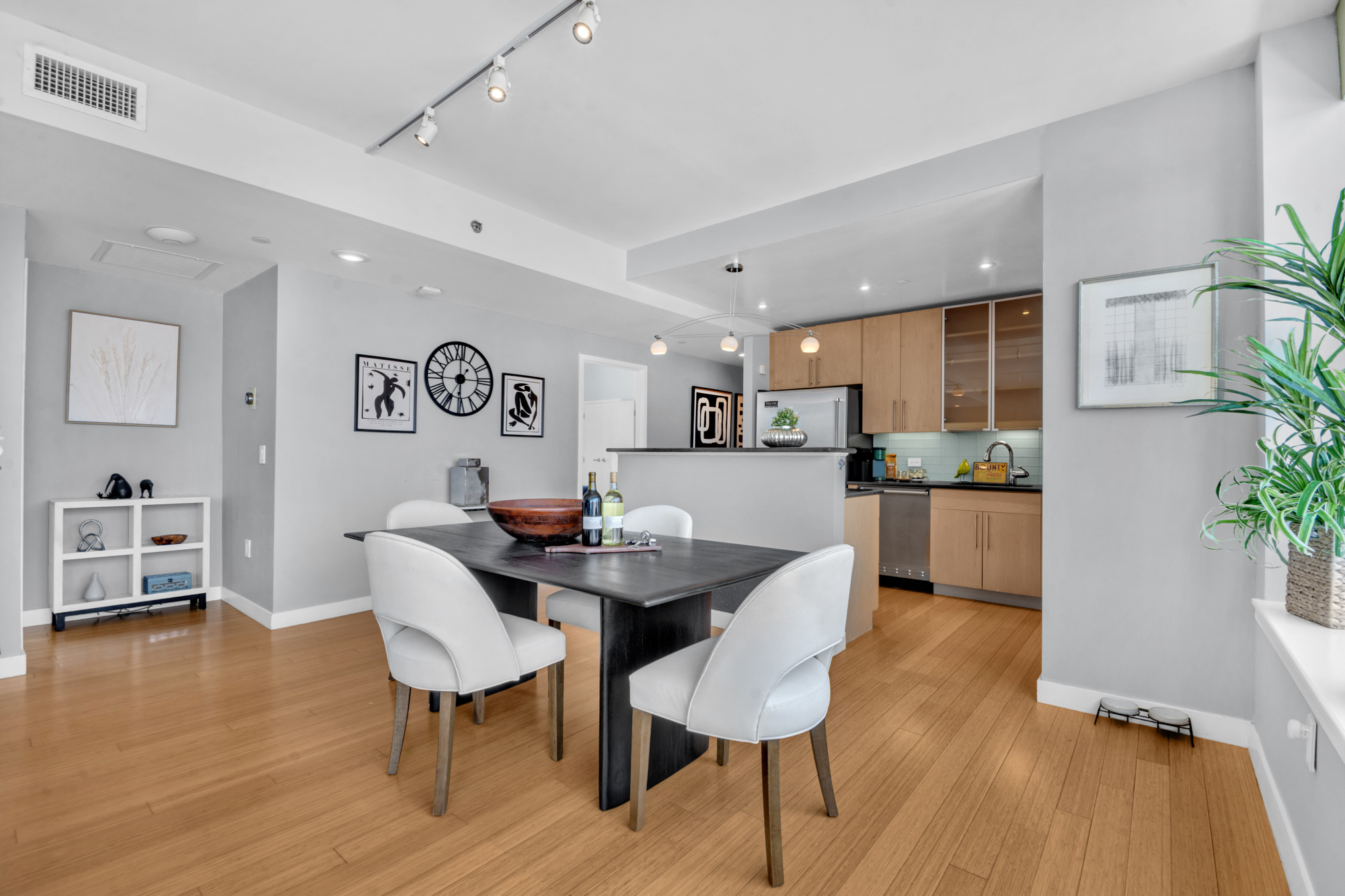 40 West 116th Street, Unit PHA1208 Manhattan, NY 10026 - Photo 4 of 28 a view of a dining room with furniture and wooden floor