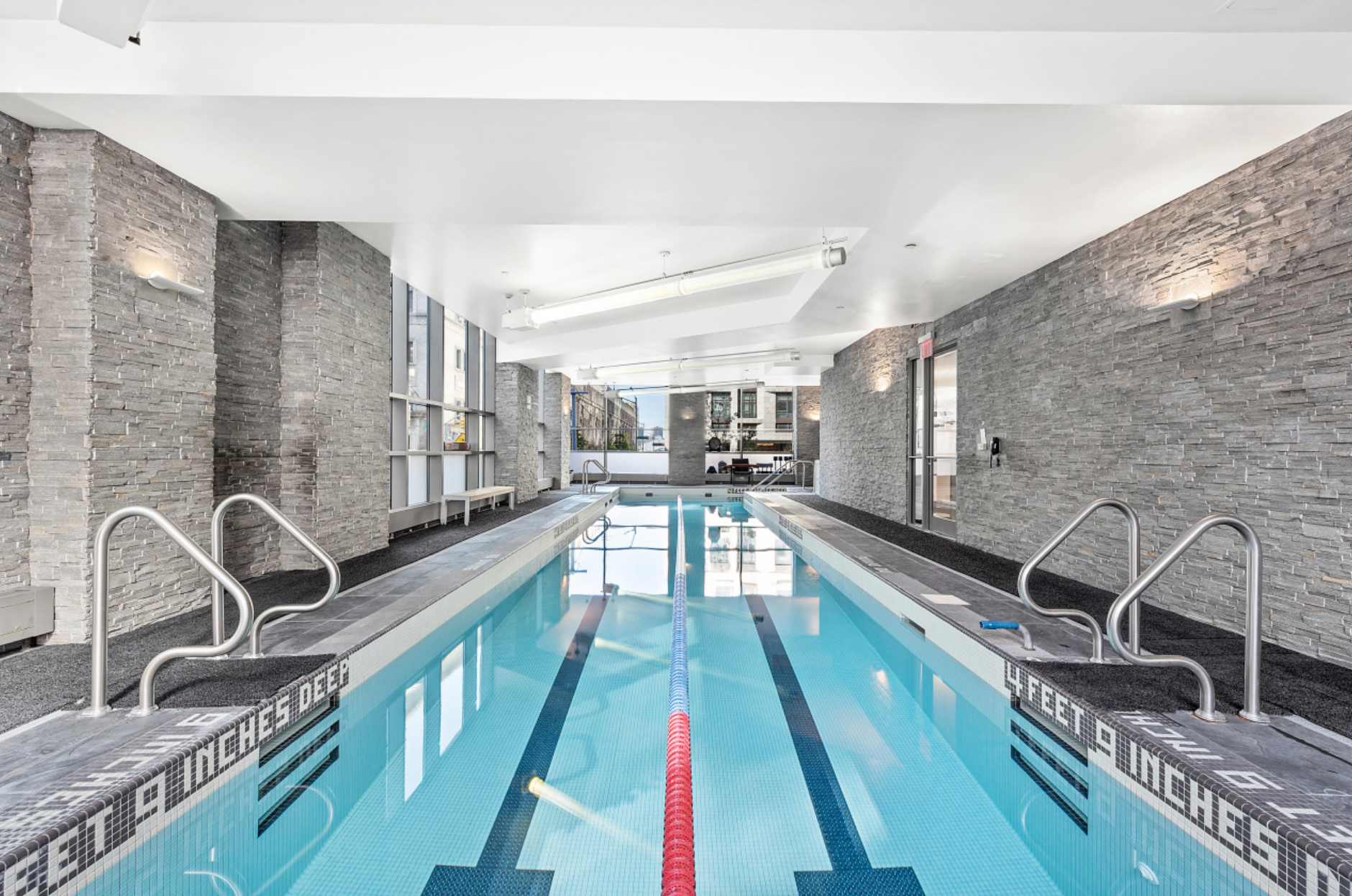 10 West End Avenue, Unit 11G Manhattan, NY 10023 - Photo 7 of 9 a large white kitchen with a large window
