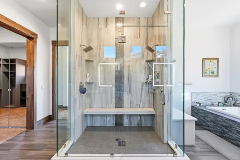 a bed room with a bed and a chair