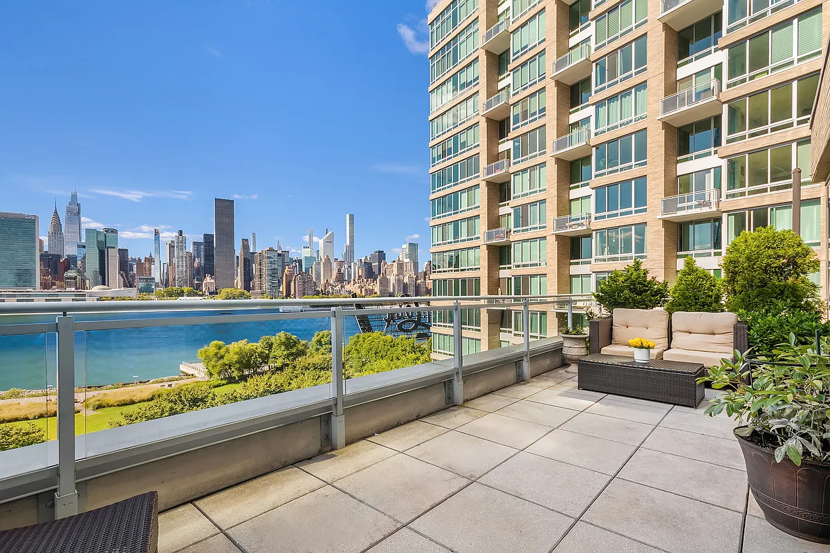 46-30 Center Boulevard, Unit 710 Queens, NY 11109 - Photo 7 of 25 a view of a lake with a terrace