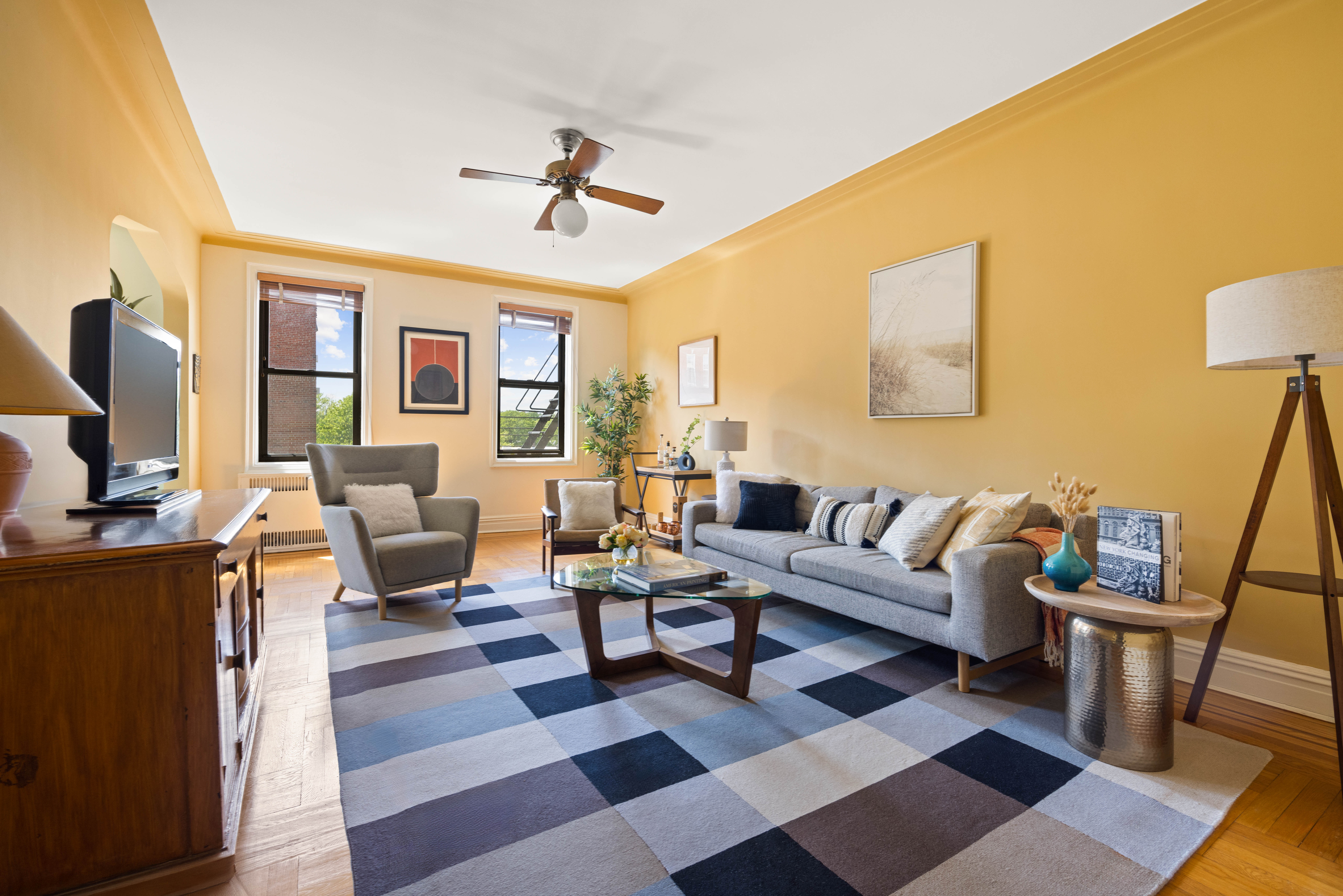 30 Ocean Parkway, Unit 5H Brooklyn, NY 11218 - Photo 2 of 17 a living room with furniture a rug and a flat screen tv
