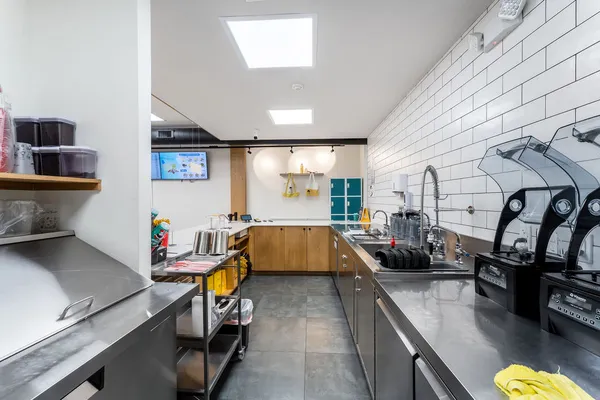 a kitchen with stainless steel appliances lots of counter space