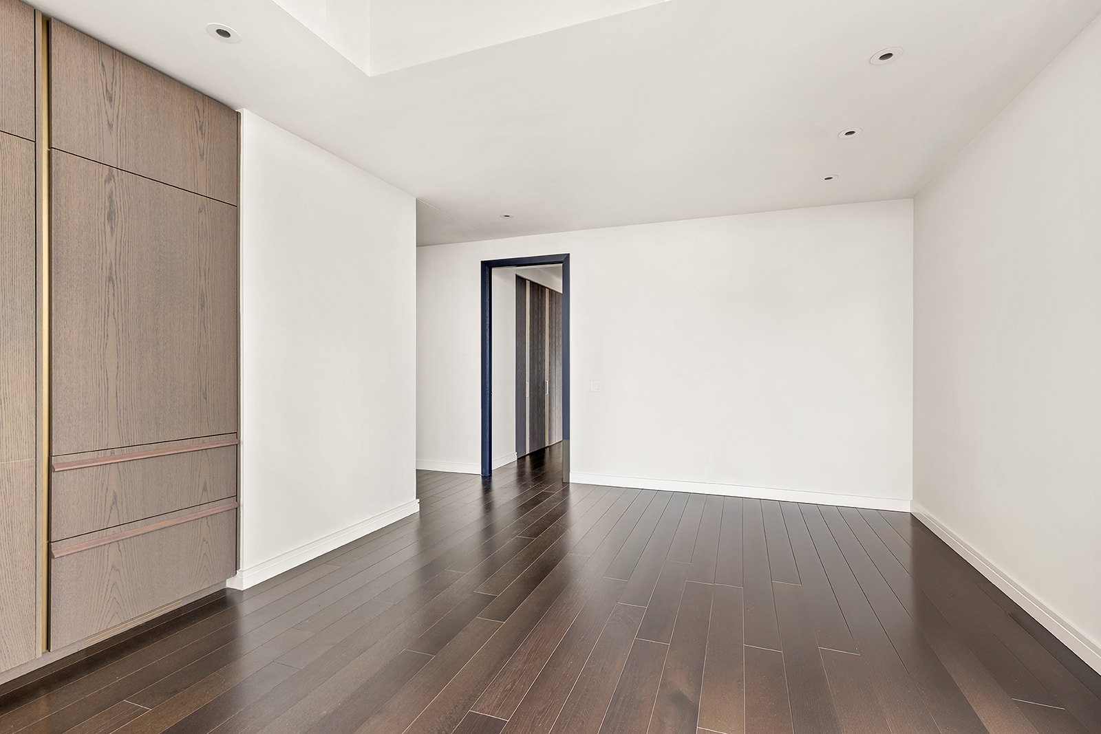 125 Greenwich Street, Unit 37C Manhattan, NY 10006 - Photo 6 of 24 a view of an empty room with wooden floor