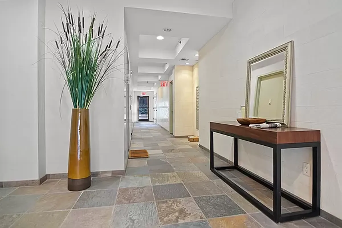 416 East 117th Street, Unit PH6 Manhattan, NY 10035 - Photo 18 of 20 a view of a hallway with furniture