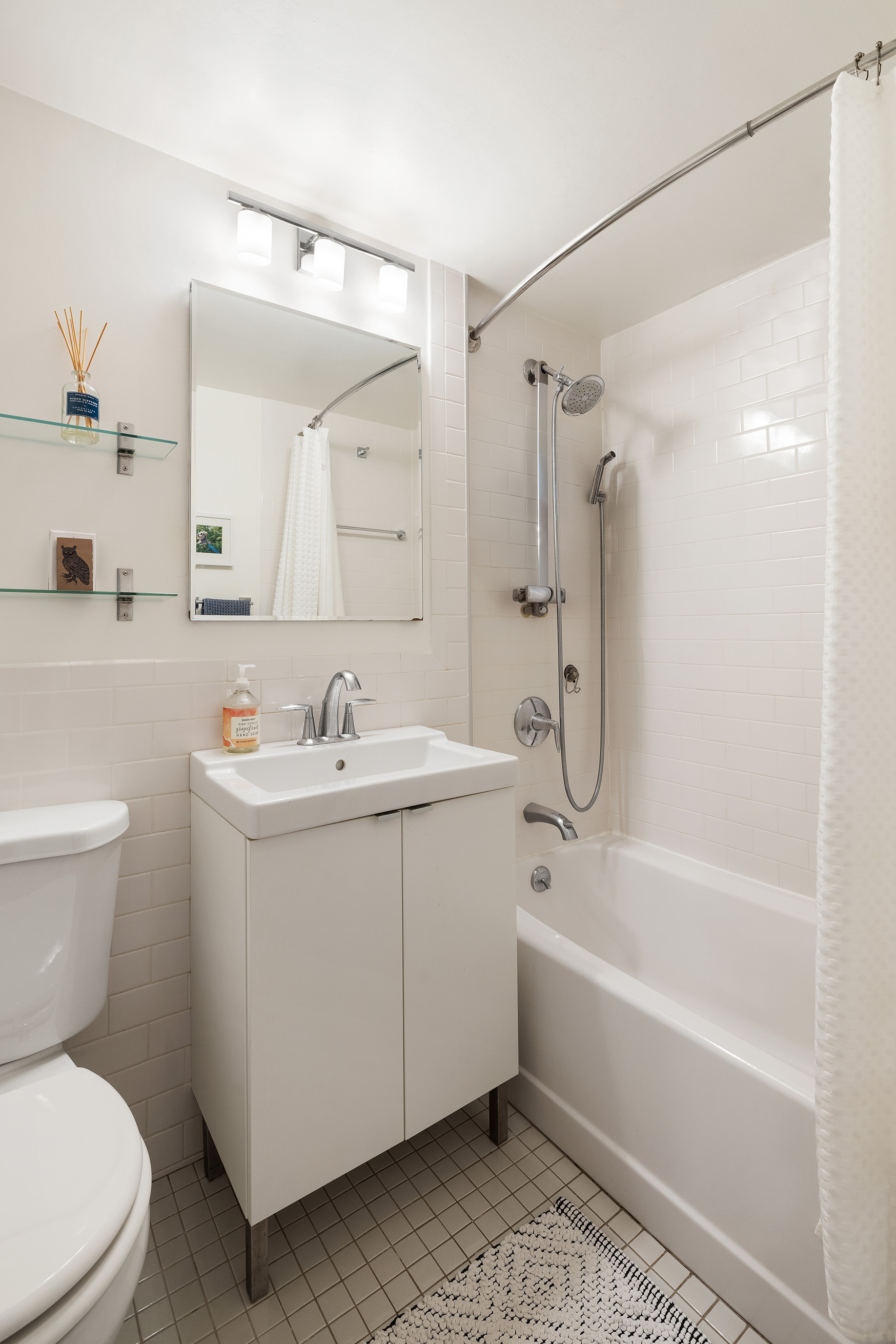 210 Clinton Avenue, Unit 8B Brooklyn, NY 11205 - Photo 7 of 8 a bathroom with a sink toilet and shower