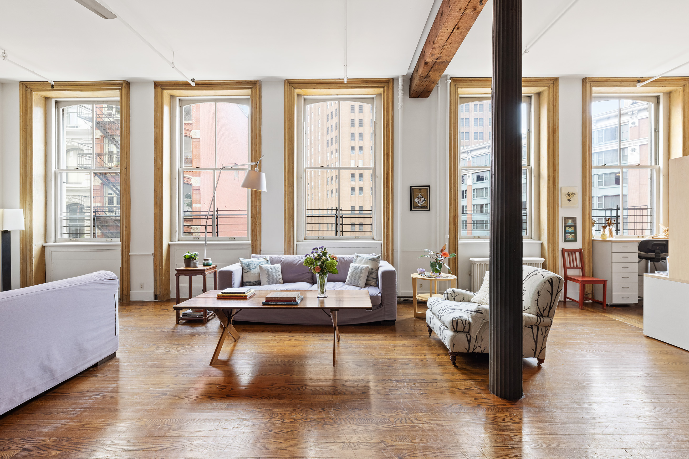 17 White Street, Unit 3B Manhattan, NY 10013 - Photo 3 of 19 a living room with furniture and floor to ceiling windows