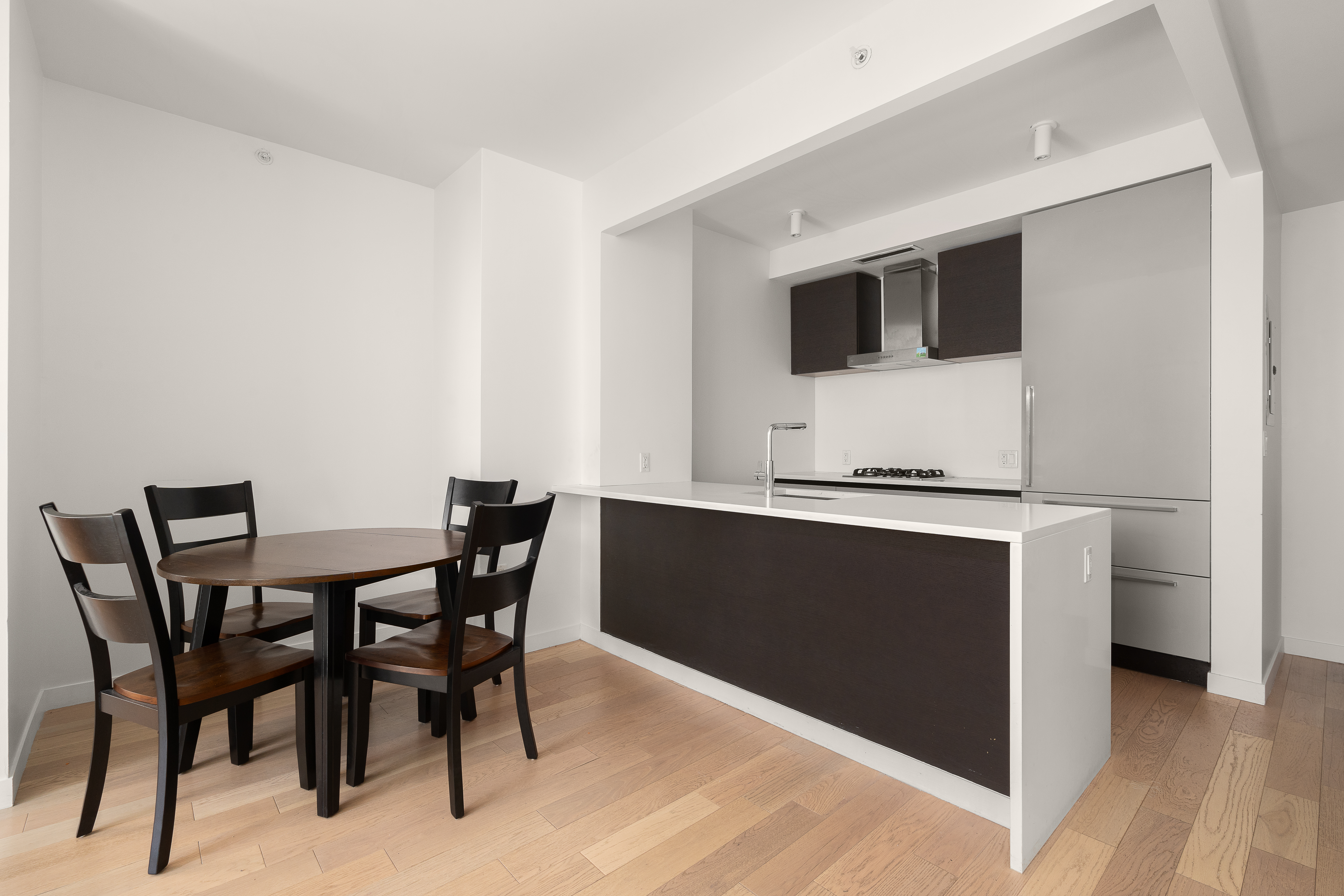 545 West 48th Street, Unit 308S Manhattan, NY 10036 - Photo 2 of 8 a view of a dining room with furniture