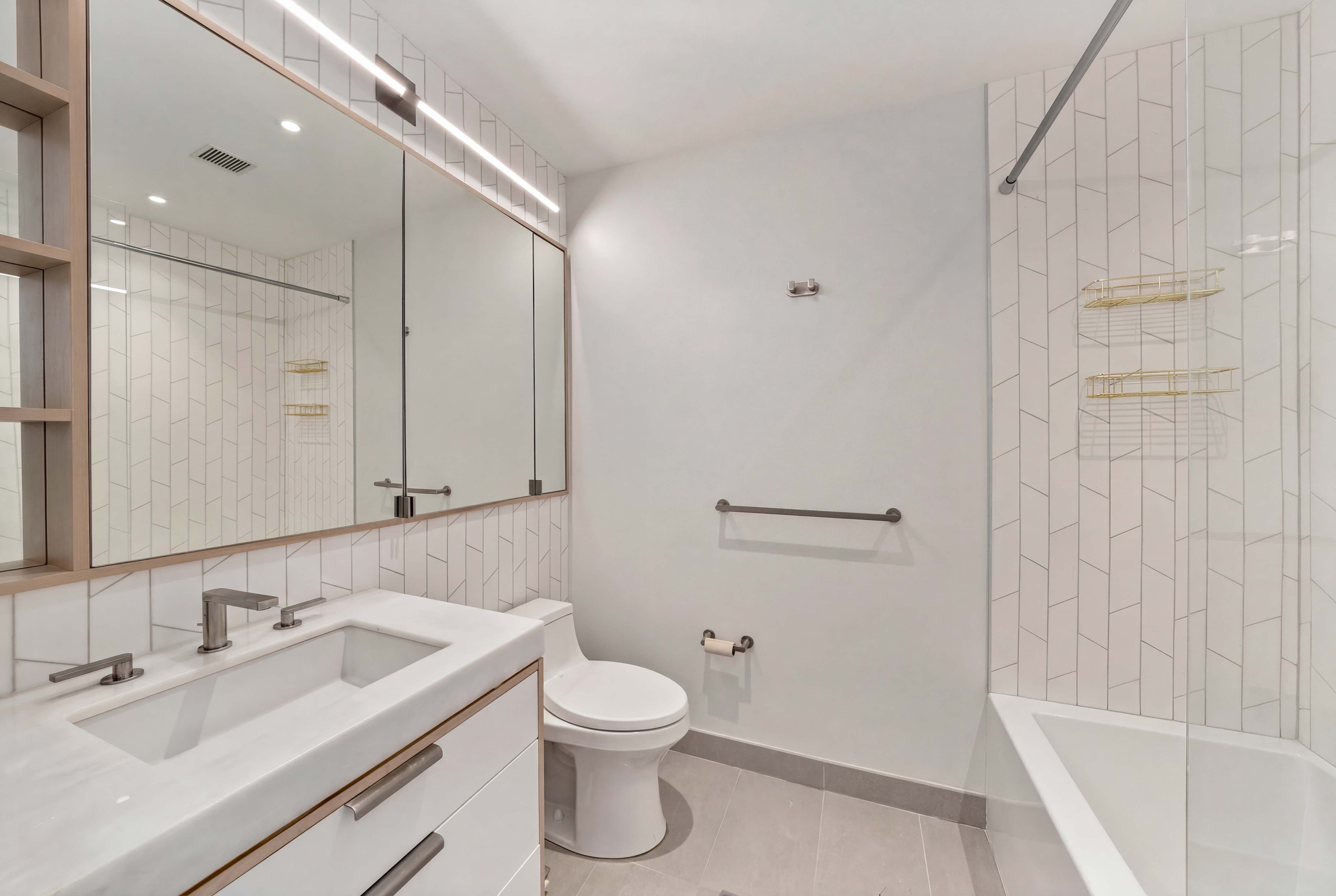 501 3rd Avenue, Unit 3C Manhattan, NY 10016 - Photo 4 of 5 a bathroom with a sink and a mirror