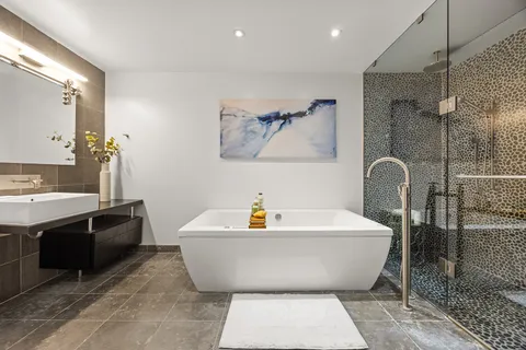 a bathroom with a bathtub and a sink