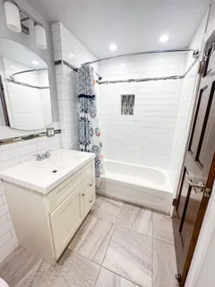 a bathroom with a sink a toilet and a bathtub