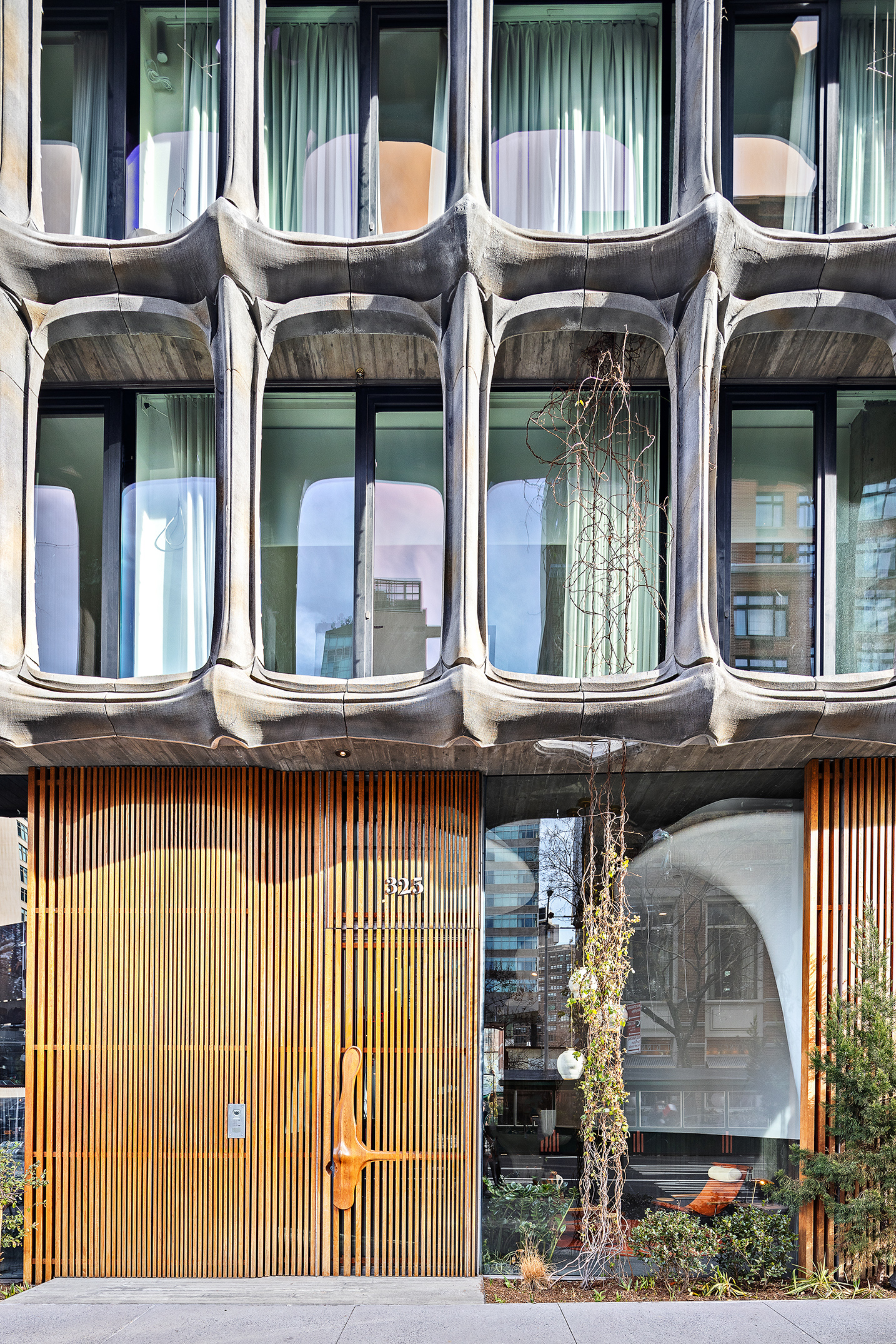 325 West Broadway, Unit 7B Manhattan, NY 10013 - Photo 19 of 21 a view of brick house with large windows and a table