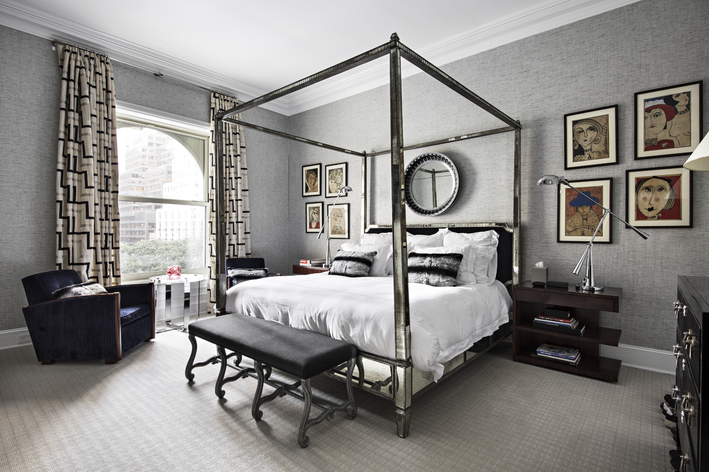 1 Central Park South, Unit 409 Manhattan, NY 10019 - Photo 8 of 26 a bedroom with a large bed and a chandelier