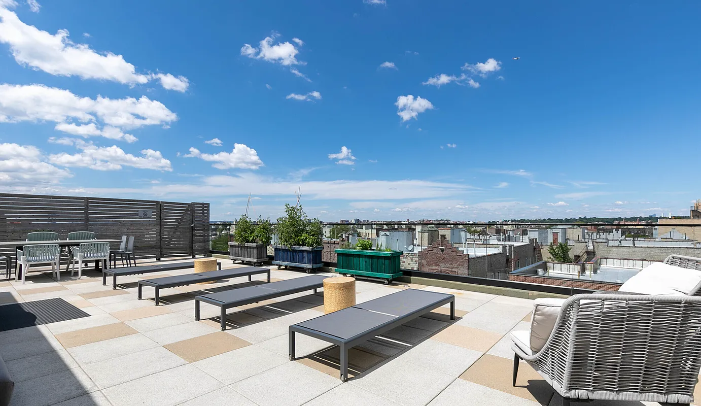 264 Webster Avenue, Unit 303 Brooklyn, NY 11230 - Photo 10 of 11 a terrace with outdoor seating and city view