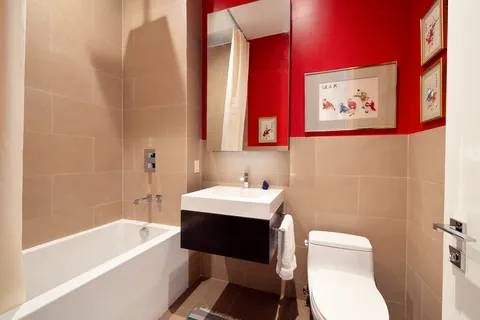 a bathroom with a sink a toilet and bathtub