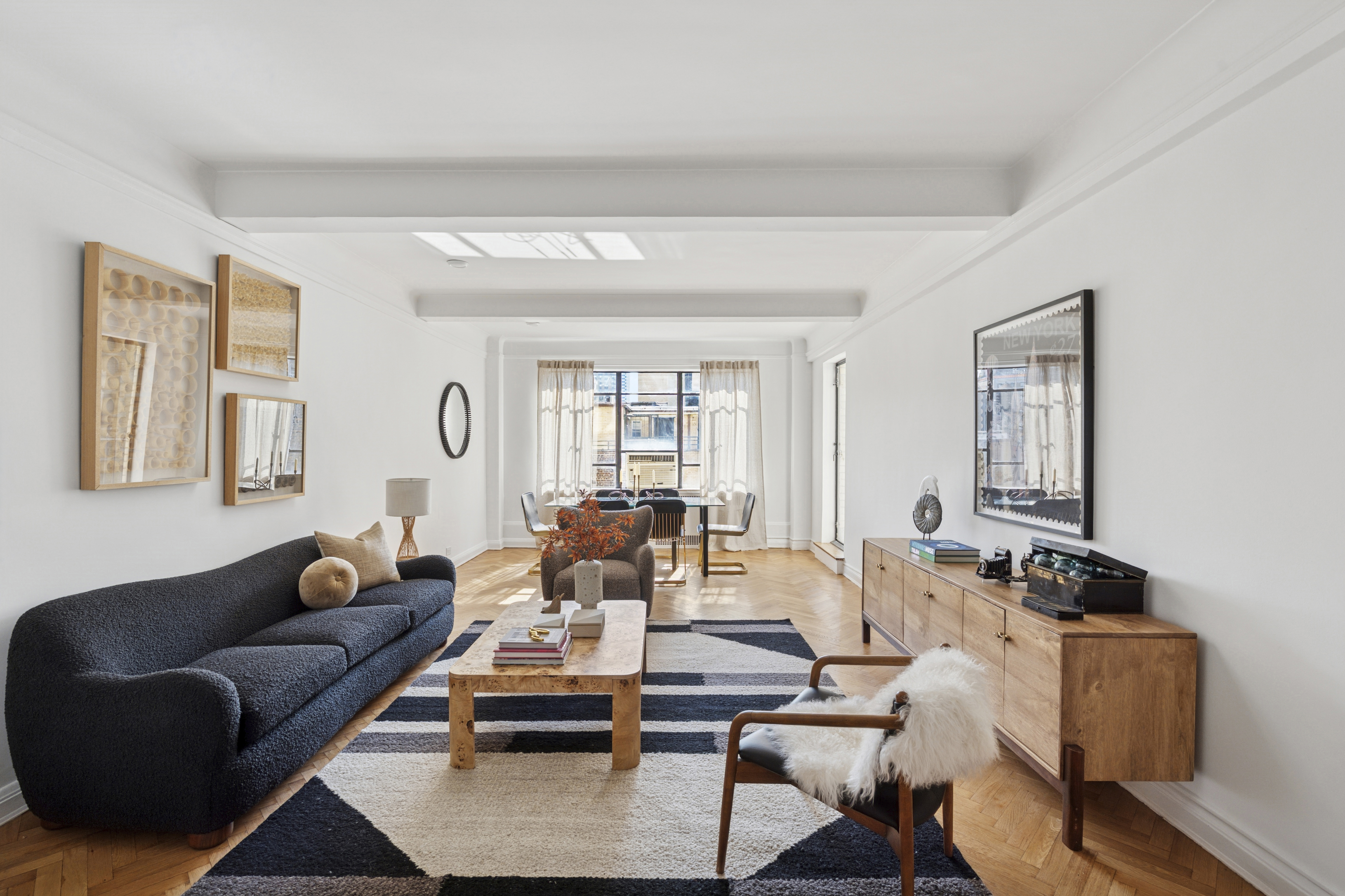 140 Riverside Drive, Unit 10N Manhattan, NY 10024 - Photo 2 of 21 a living room with furniture wooden floor and a window